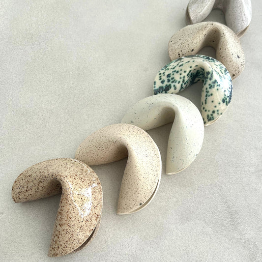 ceramic fortune cookies in neutral colors