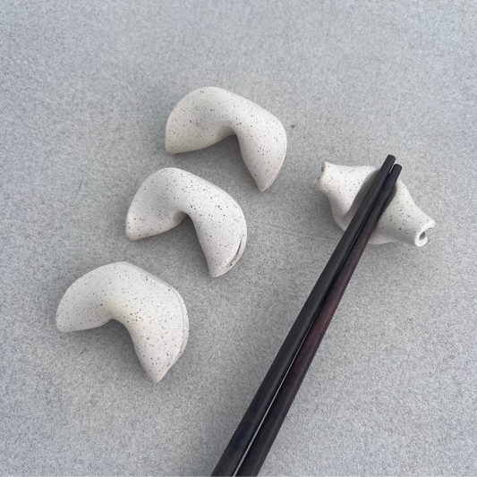 set of four ceramic chopstick holders