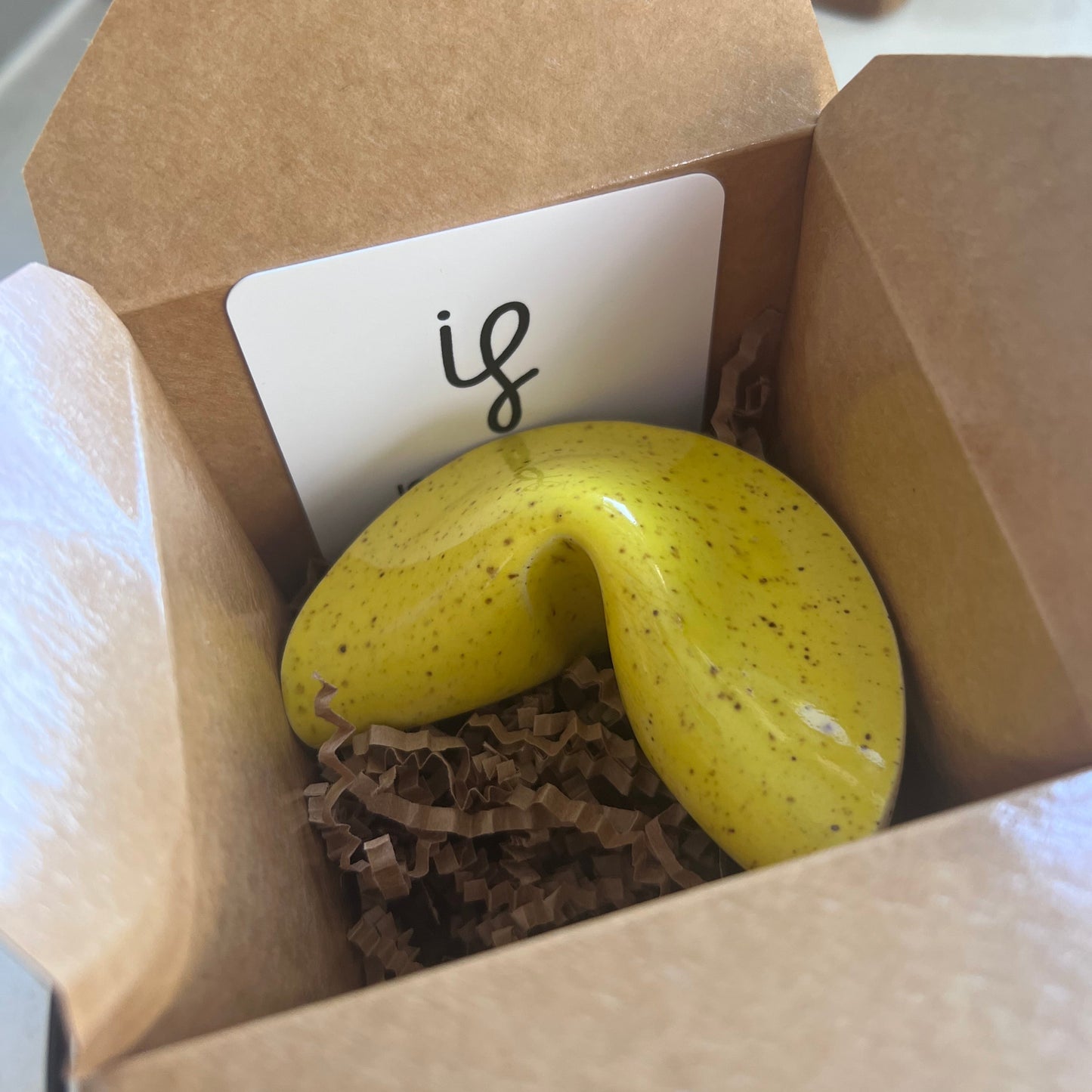 Ceramic fortune cookie with packaging