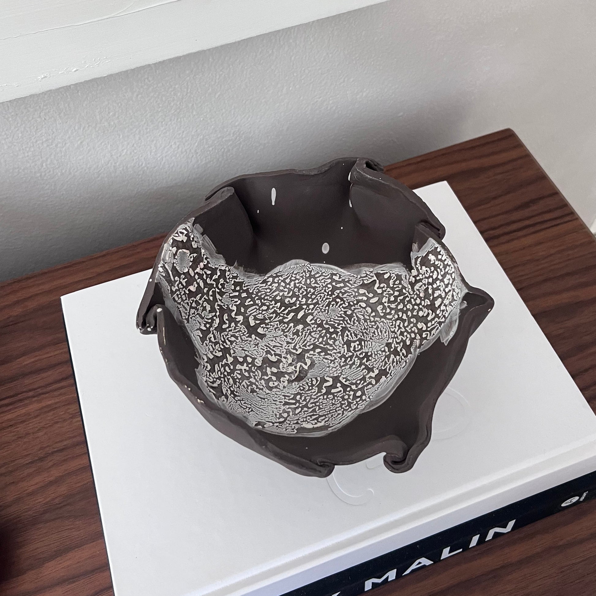 Decorative brown bowl with white cracked glaze