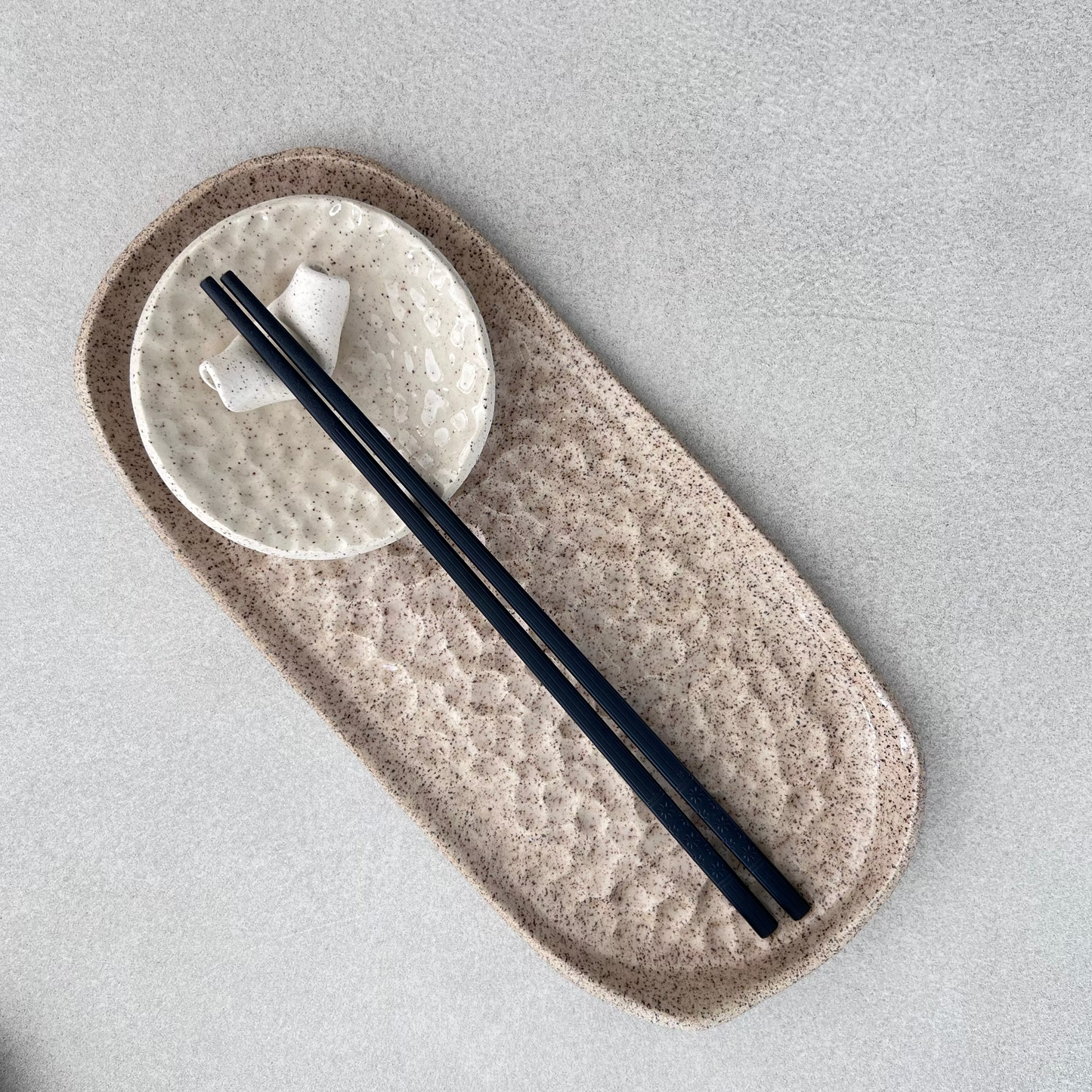 ceramic sushi dining set: chopsticks, chopstick holders, dipping dish and plate